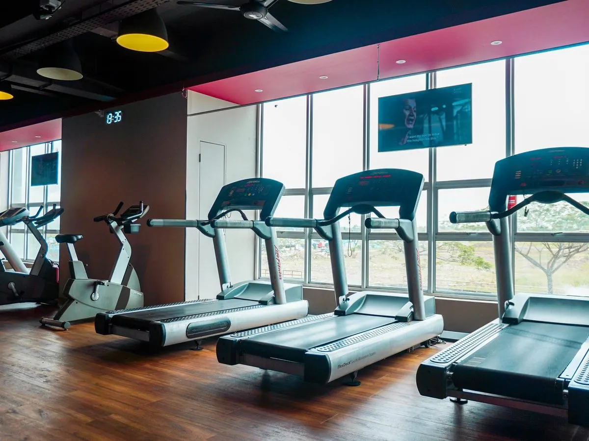 Treadmills by the window at Level Up Fitness Metrocity