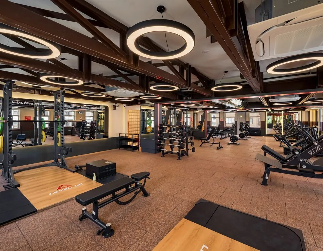 Free weights floor under timber roof trusses at Level Up Fitness Xpress Gaya Street, Kota Kinabalu - 24-hour gym