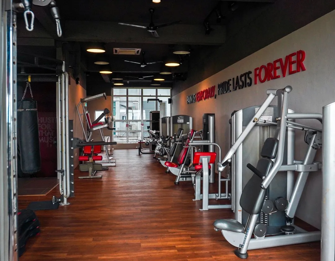 Strength machines along the feature wall at Level Up Fitness Xpress Metrocity, Kuching