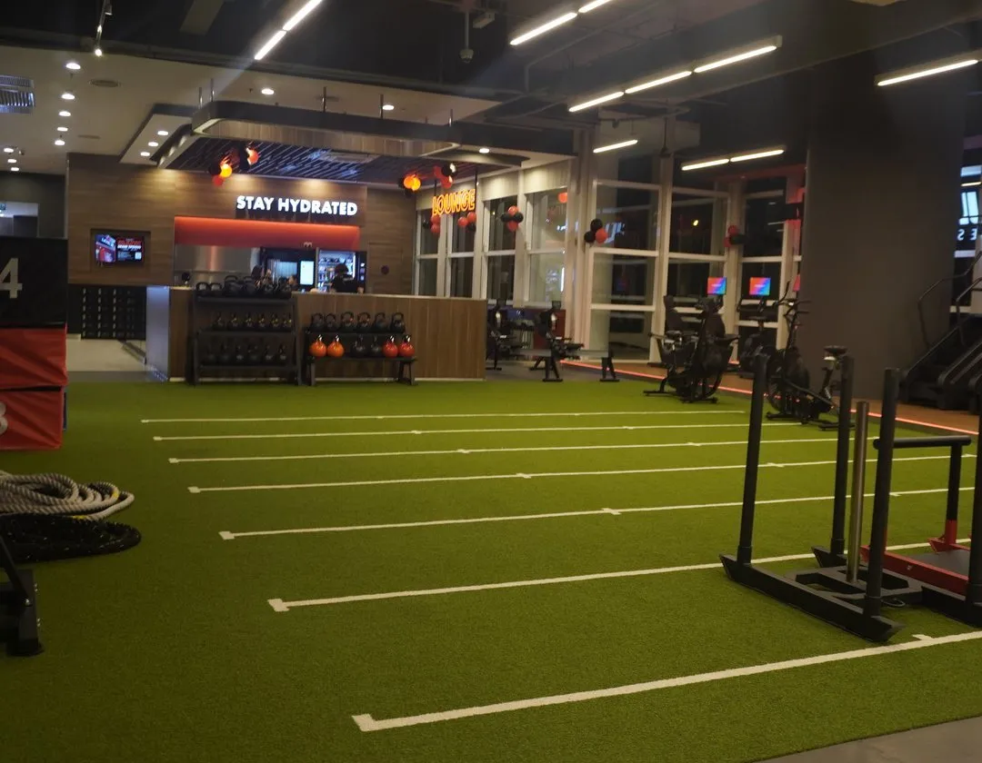 Functional turf, front desk and lounge at Level Up Fitness Paradigm Mall, Petaling Jaya