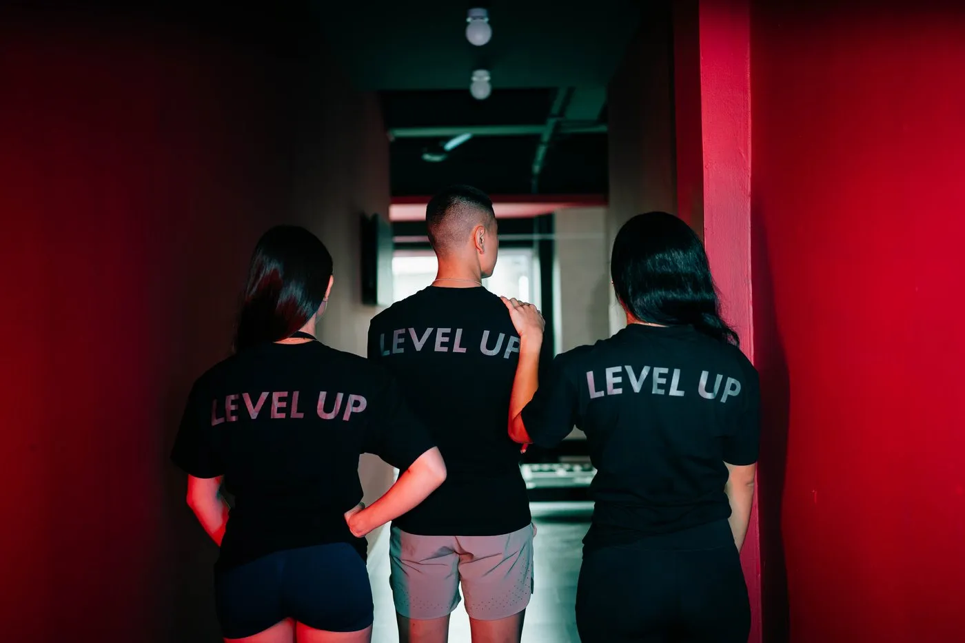 Three Level Up team members in Level Up t-shirts